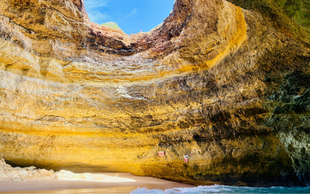 Sunlight streaming into Benagil Cave in Portugal, symbolising spiritual awakening and the healing power of travel.